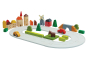 PlanToys plastic-free countryside blocks set and rubber road laid out in a small scene on a white background