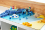 Toys by nature wooden Kallax unit topper on a white kallax covered in wooden toys to create a beach scene.