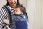 Adult babywearing a young toddler using a Tula Free To Grow Coast Baby Carrier - Edelweiss