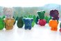 Bee Crayative eco-friendly natural beeswax animal shaped crayon set stood up on a white background in front of some wooden tree toys