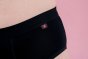 Hey Girls Basic Brief - Black Period Pants label details against a pink background