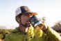 Close up of a man drinking from a klean kanteen eco-friendly metal camp mug in the black mountain colour
