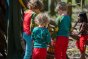 Children wearing LGR tops and trousers in the forest