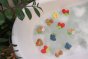 Oli and carol eco-friendly natural rubber forest fruit and nut baby teething toys floating in some bubbly bath water