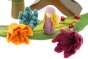 Close up of some Papoose plastic-free rainbow daffodils on a green play mat next to a Papoose bright elf figure