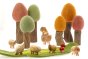 Papoose plastic-free wooden pebble animals on a green Papoose play mat in front of some wooden tree toys