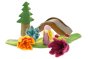 3 Papoose handmade felt daffodil flowers on a green play mat next to a Papoose bright elf, tree and wooden bridge toy