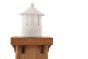 Close up on the top of the Papoose realistic handmade toy lighthouse on a white background