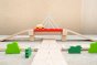 Road going under bridge on the Plan Toys wooden road playset