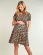 a pregnant woman wearing dress with the daisy fields print from frugi