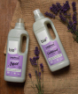 Bio D eco-friendly vegan lavender laundry liquid 1L bottle and conditioner 1 Litre bottle on a hessian background with purple lavender flowers