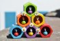 Plan Toys Bee Hives - Rainbow, colourful wooden bees in their hexagonal pot. Stacked in a triangle with daisies in between.