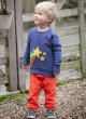  a boy wearing blue organic cotton sweatshirt with a fabulous shooting star with a rainbow tail applique design on the front from piccalilly