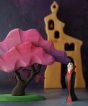 Bumbu Wooden Halloween Handmade Vampire Toy next to Pink Bumbu Japanese Maple Tree with bats, with Ostheimer Bell tower in background
