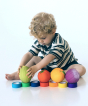 Toddler colour matching with a variety of Oli & Carol 100% Natural Rubber Baby Sensory Balls