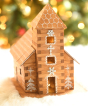 A beautifully festively decorated WALACHIA Church Hobby kit. The natural wood grain shows through on all wooden pieces and is decorated with white painted roof tiles, snowflakes and white trees