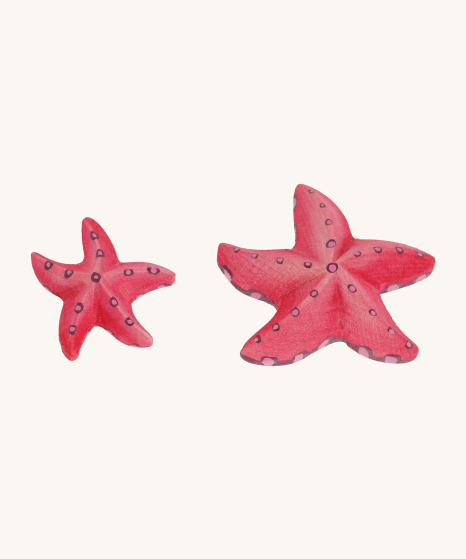 Bumbu Handmade Wooden Red Starfish Set. Beautifully hand painted star fish in light red with light pink and purple spots, on a cream background