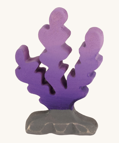 Bumbu Handmade Wooden Purple Seaweed Figure. A bright purple seaweed figure on a grey rock which has been hand painted, on a cream background