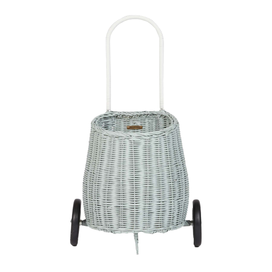 Front of the eco-friendly Olli Ella woven rattan luggy in the vintage blue colour on a white background