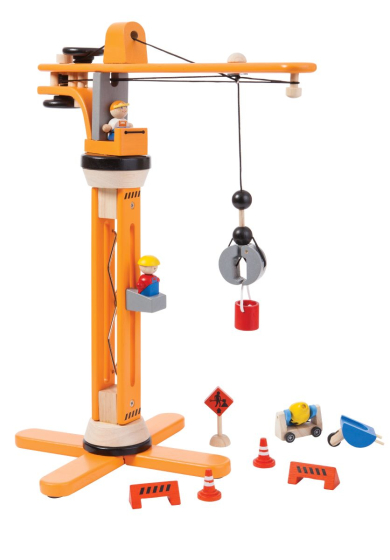 The PlanToys crane is a big orange wooden toy crane. The set includes traffic cones, barriers, a cement mixer, a wheel barrow, men at work sign, small bucket and construction worker and crane operator. White background.