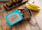 Klean Kanteen 20oz food box filled with baked goods on a wooden worktop next to some bananas