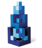 Blue Naef Cubicus stacked in a pyramid tower with smallest cube piece at the top. Tower is placed on a white background.