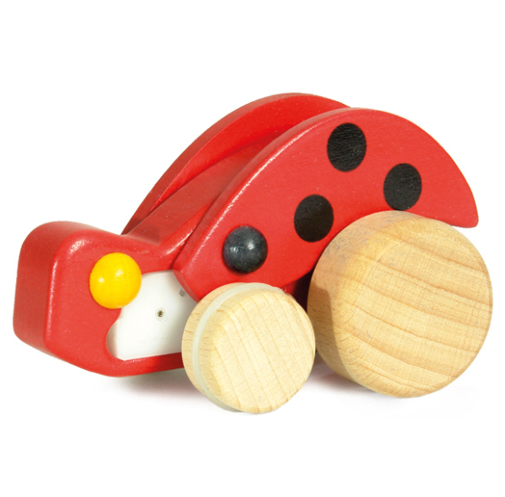 The Bajo Pull-Back Ladybird has natural wood wheels, a red body with black spots on and wings that move as it is pulled back, making a fun buzzing sound as it travels.