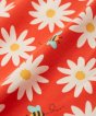 frugi daisy print detail, red colour with bees and white daisies