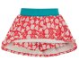 shorts part of vibrant pink organic cotton jersey skirt with a beautiful white seashell print, layered over shorts with a stretchy fold-down blue waistband from frugi