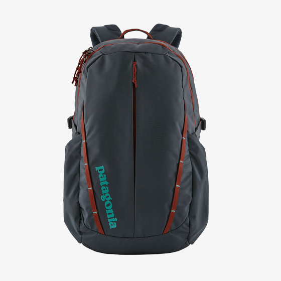 Picture of the smolder blue and red roots Refugio 28L backpack. Picture background is white.