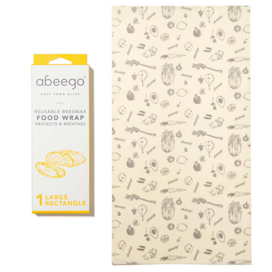 Abeego large rectangular beeswax food wrap laid out on a white background next to its packaging