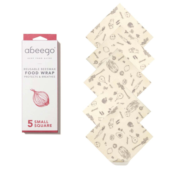 5 small Abeego beeswax food wraps laid out in a line on a white background next to their packaging