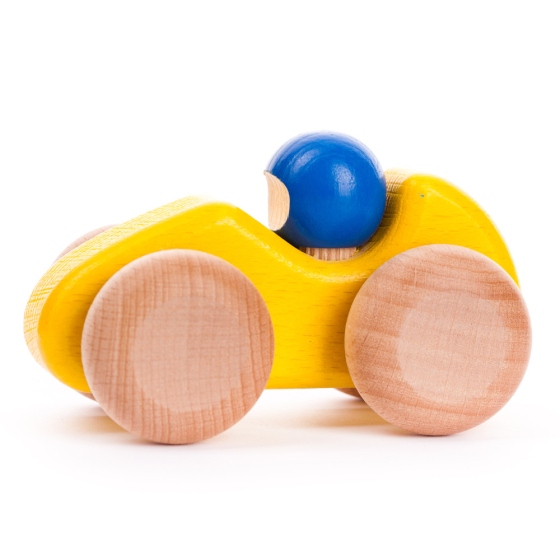 Bajo yellow handmade wooden race car toy on a white background