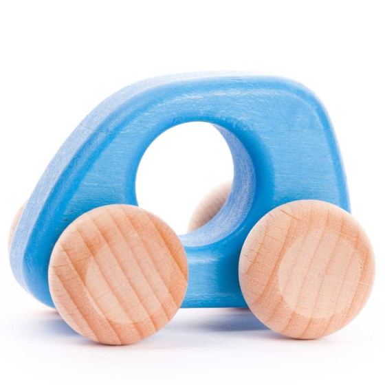 The Bajo Mini Car in a light blue painted finish is a dinky wooden toy car designed for little hands. The cutout hole in the centre helps give a good grip while manoeuvring