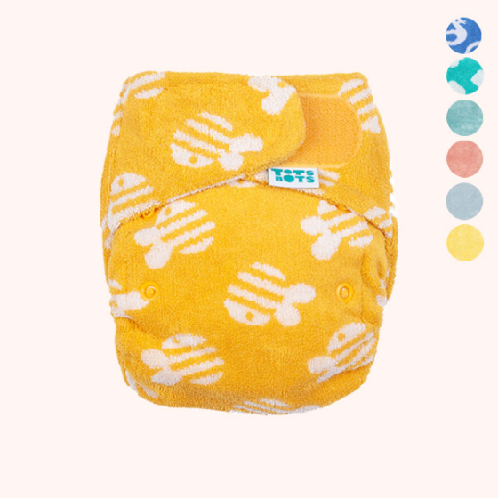 yellow totsbots newborn bamboozle nappy with graphic to show other colours available too