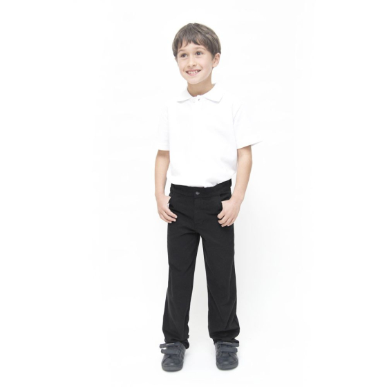 A child wearing Eco Outfitters GOTS organic cotton school uniform trousers - boys slim fit in black, with a white polo shirt and black shoes, smiling with thumbs in pockets. White background
