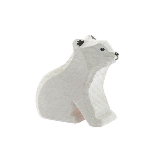 Bumbu childrens hand carved sitting baby polar bear toy on a white background
