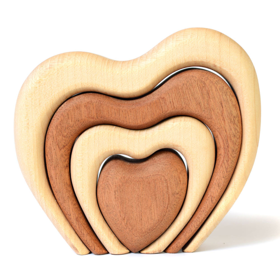 Bumbu hand carved wooden stacking heart on a white background