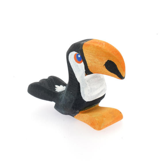 Bumbu handmade wooden baby toucan figure on a white background