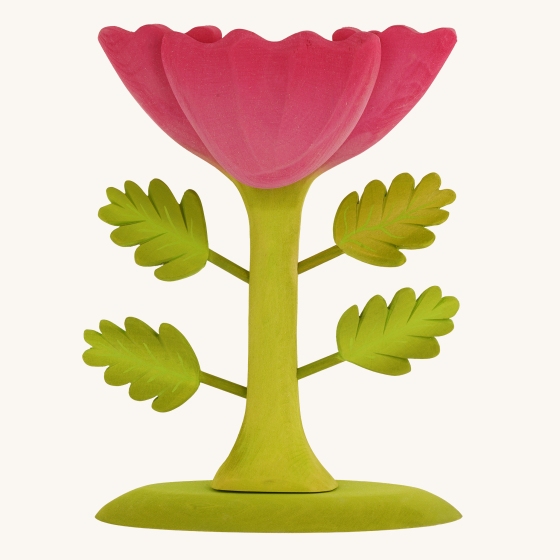 The Large Pink Flower by Bumbu is an impressive wooden flower with four leaves and a rich pink bloom, it stands on a green wooden base, with a cream background