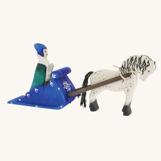 Bumbu handmade wooden snow queen, sleigh and white horse toy set on a cream background