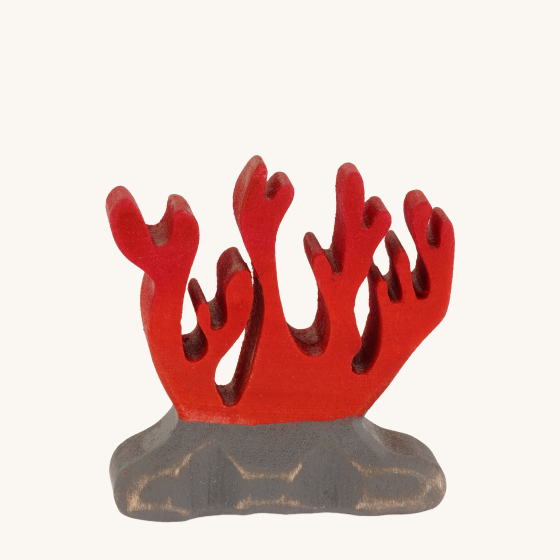 Bumbu Wooden Red Coral Toy. A fiery red coral that's been hand crafted and hand painted on a grey rock, on a cream background