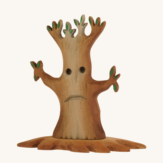 Bumbu Large Wooden Spooky Tree. A hancarved wooden toy in the shape of a spooky Halloween tree, with dying leaves and a sad grumpy face.