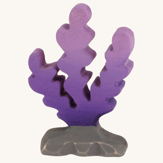 Bumbu Handmade Wooden Purple Seaweed Figure. A bright purple seaweed figure on a grey rock which has been hand painted, on a cream background