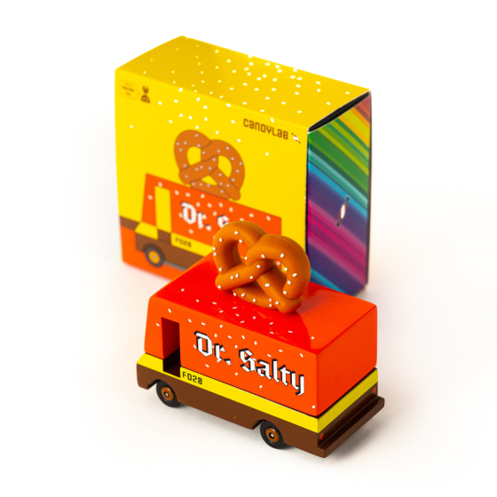 Candylab Candyvan pretzel truck toy on a white background next to its cardboard box