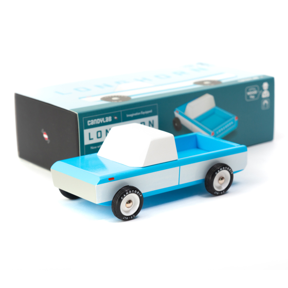 Candylab childrens handmade wooden longhorn car toy on a white background next to its box