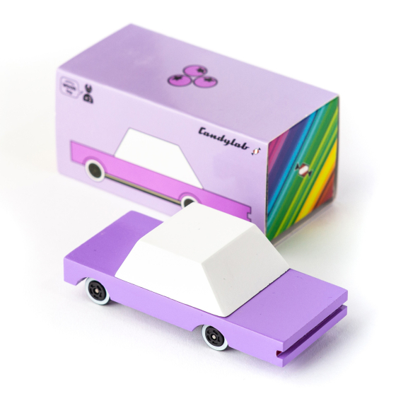 Candylab kids handmade wooden B.Berry car toy on a white background next to its purple cardboard box