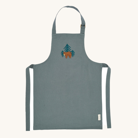 Avery Row Kid's Apron - Forest Bear. A beautiful blue cotton canvas apron with a detailed, embroidered bear and tree pattern of the chest of the apron. 