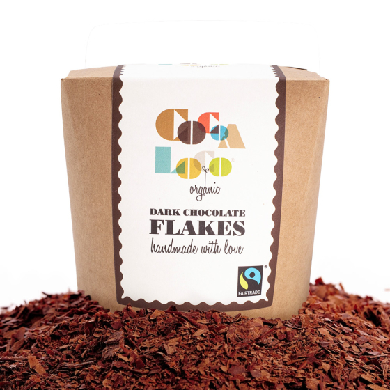 Box Cocoa Loco organic Fairtrade dark hot chocolate flakes on top of a pile of chocolate flakes