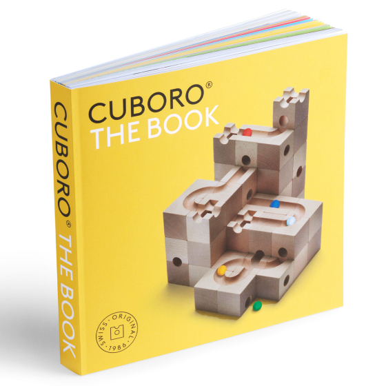 Cuboro marble run tips & tricks guide book stood up on a white background showing the yellow cover